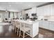 Modern kitchen with white cabinets, island, and breakfast bar at 411 Moondance Dr, Gastonia, NC 28054