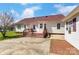 A backyard featuring a deck and a detached garage, providing ample outdoor living and storage space at 416 Linsbury Ct, Gastonia, NC 28056