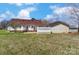 Spacious backyard featuring a deck and detached garage at 416 Linsbury Ct, Gastonia, NC 28056