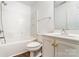 This well-lit bathroom features a shower-tub combo and a vanity with a sink and storage space at 416 Linsbury Ct, Gastonia, NC 28056