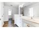 Bright bathroom features white vanity, double sinks, and modern fixtures at 416 Linsbury Ct, Gastonia, NC 28056