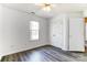 Bedroom features hardwood floors, closet, and large window at 416 Linsbury Ct, Gastonia, NC 28056