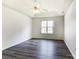 Spacious bedroom with hardwood floors, tray ceiling, and a bright window at 416 Linsbury Ct, Gastonia, NC 28056