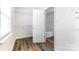 Walk-in closet next to a bright bathroom with a soaking tub at 416 Linsbury Ct, Gastonia, NC 28056