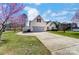 Lovely home with extended driveway, a two-car garage, lush lawn and mature trees at 416 Linsbury Ct, Gastonia, NC 28056
