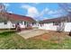 Charming backyard showcasing a spacious patio, a detached garage and a well-kept lawn at 416 Linsbury Ct, Gastonia, NC 28056