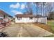 This detached garage has a convenient concrete parking pad in a backyard setting at 416 Linsbury Ct, Gastonia, NC 28056