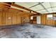 Interior view of detached garage, including shelving, windows, and electrical outlets at 416 Linsbury Ct, Gastonia, NC 28056
