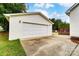 View of the detached garage with a lawn, the home's siding, and a concrete driveway at 416 Linsbury Ct, Gastonia, NC 28056