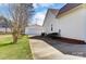 View of the home's detached garage with driveway and manicured lawn at 416 Linsbury Ct, Gastonia, NC 28056