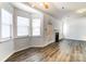 Spacious living room with hardwood floors, bright windows, and a cozy fireplace at 416 Linsbury Ct, Gastonia, NC 28056