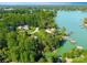 Aerial view of waterfront homes surrounded by lush greenery along a serene lake at 156 Marietta Rd, Mooresville, NC 28117