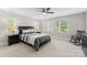 Neutral bedroom featuring natural light, a ceiling fan, carpet and a comfortable bed at 156 Marietta Rd, Mooresville, NC 28117