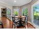 A sunlit breakfast nook includes a round table and chairs, and a fireplace in the background at 156 Marietta Rd, Mooresville, NC 28117