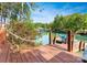 Beautiful lake view from the private dock with a boat house in the background at 156 Marietta Rd, Mooresville, NC 28117