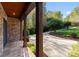 Covered front porch with stone accents and a view of the winding driveway at 156 Marietta Rd, Mooresville, NC 28117