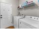 Laundry room includes a full size washer and dryer with storage shelves at 156 Marietta Rd, Mooresville, NC 28117