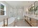 Bathroom featuring a freestanding tub, walk-in glass shower and double vanity sinks at 2621 Ritz Ln, Matthews, NC 28105