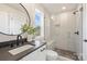 Modern bathroom with walk-in shower, sleek vanity, and stylish fixtures and finishes at 2621 Ritz Ln, Matthews, NC 28105