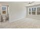 Bedroom featuring neutral carpet, large windows and ensuite bathroom at 2621 Ritz Ln, Matthews, NC 28105