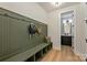 Mudroom with built-in bench, storage cubbies, and access to a half bathroom at 2621 Ritz Ln, Matthews, NC 28105