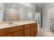 Bathroom features a spacious vanity, a large mirror, tile floors, and a shower with a curtain at 4145 Cindy Ln, Denver, NC 28037