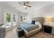 Bright bedroom featuring a bed, bedside table, and patio doors that lead to the exterior at 4145 Cindy Ln, Denver, NC 28037