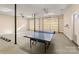 Spacious two car garage featuring a ping pong table and easy outdoor access at 4145 Cindy Ln, Denver, NC 28037