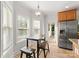 Kitchen featuring a table near the windows, stainless steel refrigerator, and tile floors at 4145 Cindy Ln, Denver, NC 28037