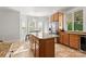 Bright kitchen featuring an island, granite countertops and stainless steel appliances at 4145 Cindy Ln, Denver, NC 28037