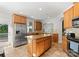 Well-appointed kitchen boasts granite countertops, stainless appliances, and ample cabinet space at 4145 Cindy Ln, Denver, NC 28037