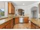 Well-designed kitchen showcasing granite counters, stainless steel appliances, and custom cabinets at 4145 Cindy Ln, Denver, NC 28037
