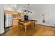 Convenient kitchenette featuring a sink, refrigerator, wine cooler, and ample cabinet space at 4145 Cindy Ln, Denver, NC 28037