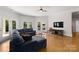 Inviting living room with a comfortable sofa, tile flooring, and views of the backyard at 4145 Cindy Ln, Denver, NC 28037
