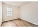 Bright bedroom with wood-look flooring and large window at 4469 Doyle Ridge Rd, Maiden, NC 28650