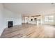 Open living room with hardwood floors and a fireplace at 4469 Doyle Ridge Rd, Maiden, NC 28650