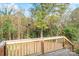 Wooden deck overlooking a wooded backyard at 83 Woodsdale Se Pl, Concord, NC 28025