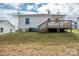 Rear view of house with deck and fenced yard at 83 Woodsdale Se Pl, Concord, NC 28025