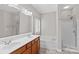 Bathroom with double vanity, soaking tub, and shower at 9826 Edinburgh Ln # 282, Charlotte, NC 28269