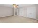 Spacious bedroom with neutral walls, ceiling fan and carpet flooring at 9826 Edinburgh Ln # 282, Charlotte, NC 28269