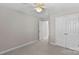 Bright bedroom with double doors and ceiling fan at 9826 Edinburgh Ln # 282, Charlotte, NC 28269