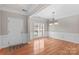 Spacious entryway with hardwood floors and access to dining room at 9826 Edinburgh Ln # 282, Charlotte, NC 28269