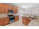 Kitchen with stainless steel appliances and granite countertops at 9826 Edinburgh Ln # 282, Charlotte, NC 28269