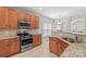 Spacious kitchen with granite countertops and stainless steel appliances at 9826 Edinburgh Ln # 282, Charlotte, NC 28269