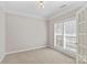 Neutral-toned office with plantation shutters and carpet flooring at 9826 Edinburgh Ln # 282, Charlotte, NC 28269