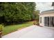 Large backyard with patio, grass, and trees at 15634 Normans Landing Dr, Charlotte, NC 28273