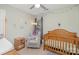 bedroom with crib, chair, and ample natural light at 2417 Ivy Run Dr, Indian Trail, NC 28079