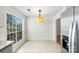 Bright breakfast nook with ample natural light from a large window at 10423 Brawley Ln, Charlotte, NC 28215