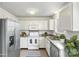 Tastefully staged kitchen with stainless steel appliances and decorative backsplash at 10423 Brawley Ln, Charlotte, NC 28215