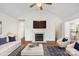 Well-staged living room features a fireplace and comfortable seating at 10423 Brawley Ln, Charlotte, NC 28215